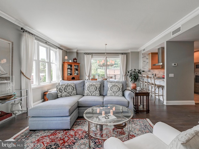 living room with dark wood-type flooring and ornamental molding