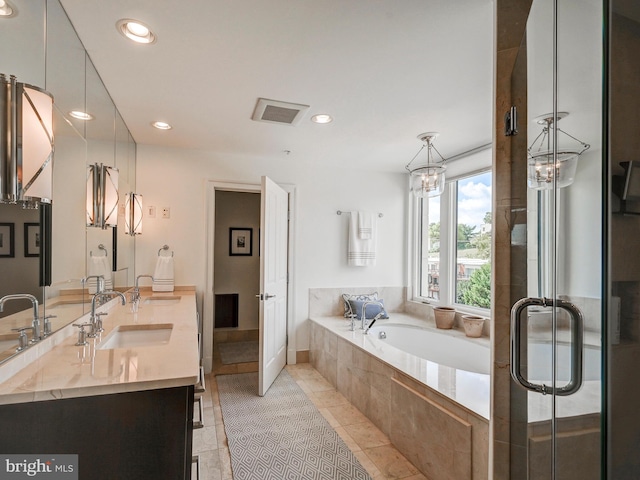 bathroom with vanity, tile patterned floors, and independent shower and bath