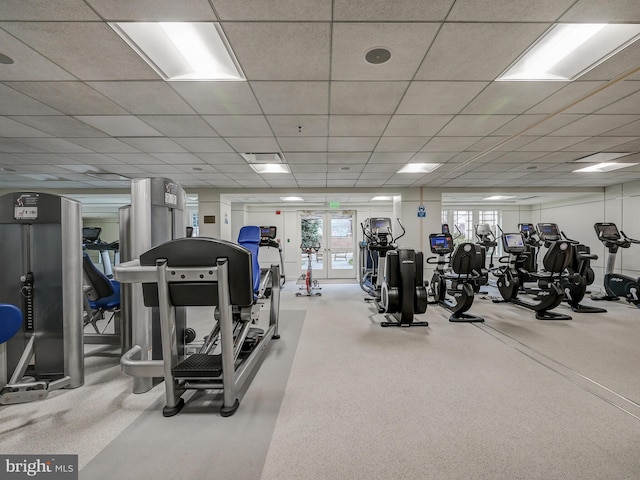 exercise room featuring a drop ceiling