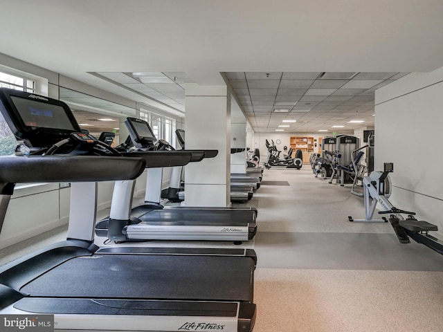 gym featuring a drop ceiling