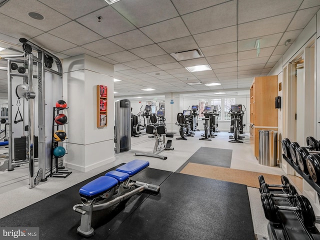 exercise room with a paneled ceiling