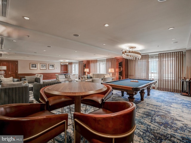 rec room featuring carpet, a healthy amount of sunlight, pool table, and a chandelier