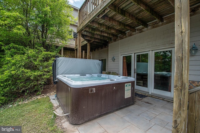 view of patio with a hot tub and cooling unit