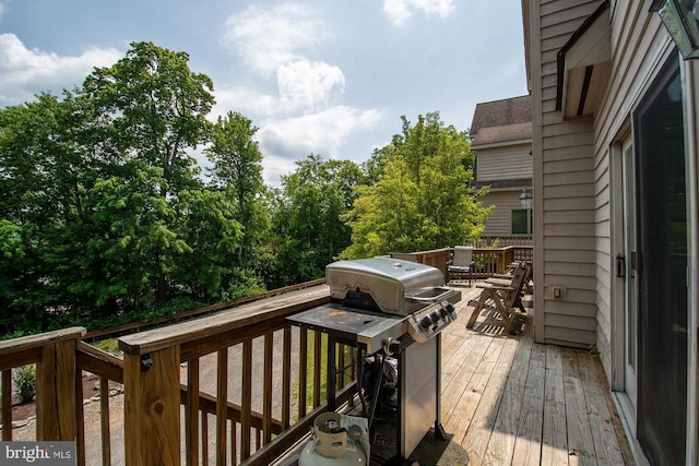 wooden deck featuring grilling area