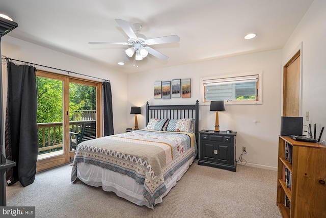 bedroom with ceiling fan, light colored carpet, and access to outside