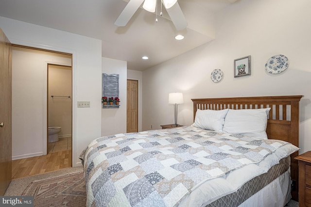 bedroom with connected bathroom, ceiling fan, a closet, and dark wood-type flooring