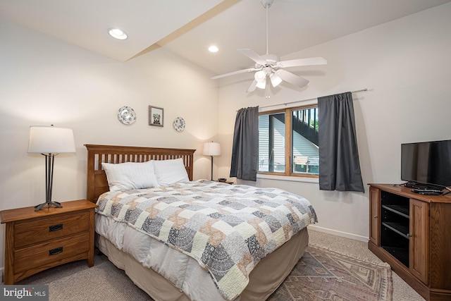 bedroom with carpet flooring, vaulted ceiling, and ceiling fan