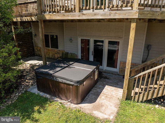 deck with a hot tub