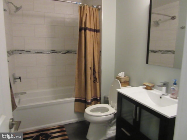 full bathroom featuring vanity, toilet, and shower / bath combination with curtain