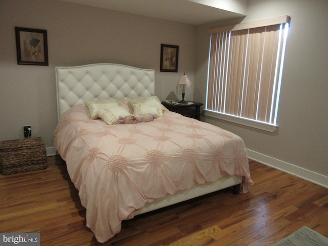 bedroom featuring dark wood-type flooring