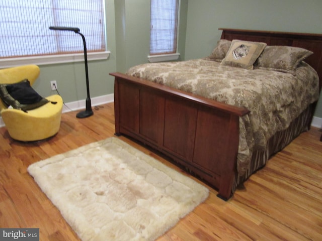 bedroom with light hardwood / wood-style flooring