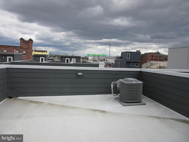 view of patio featuring a balcony and central air condition unit