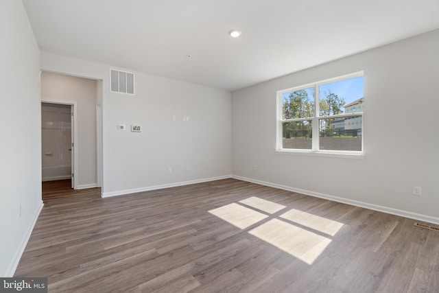 empty room featuring hardwood / wood-style floors