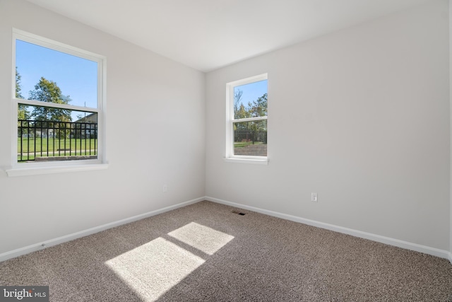 empty room with carpet flooring