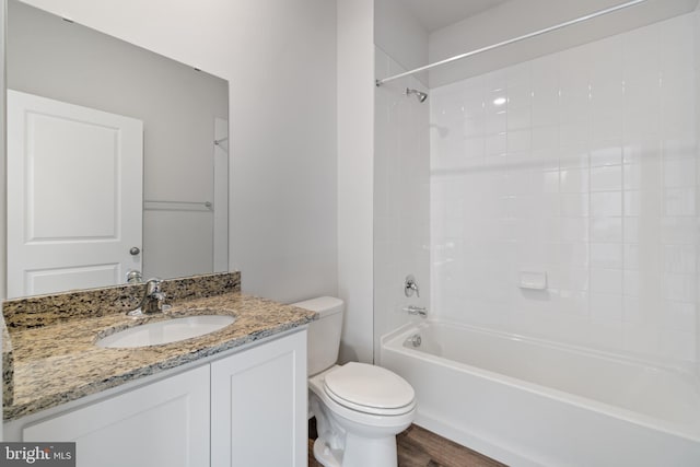 full bathroom with vanity, toilet, wood-type flooring, and tub / shower combination