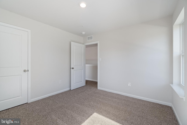 unfurnished bedroom with carpet