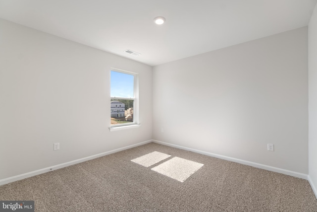 spare room featuring carpet flooring