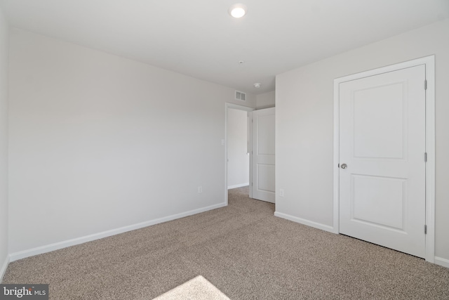 unfurnished bedroom featuring carpet