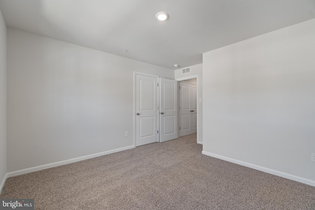 unfurnished bedroom with carpet floors