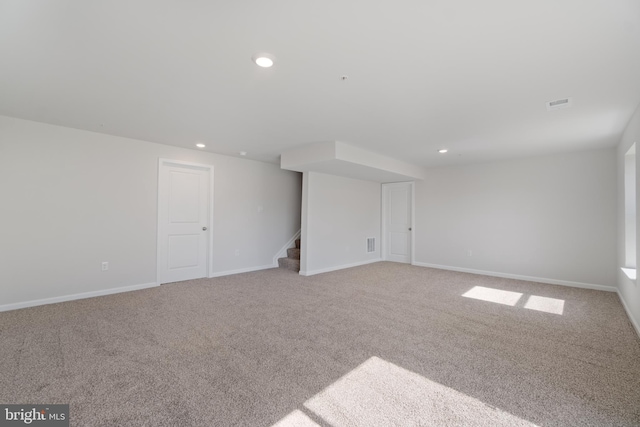 empty room with light colored carpet