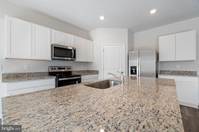 kitchen featuring sink, white cabinetry, and stainless steel appliances