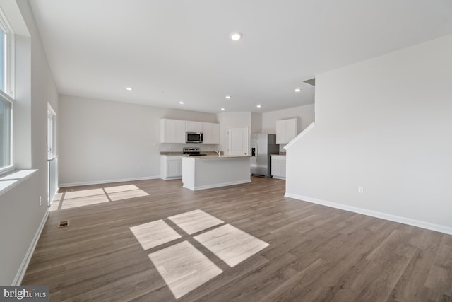 unfurnished living room with light hardwood / wood-style flooring