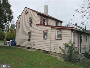 view of side of home featuring a lawn