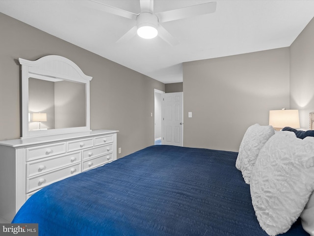 carpeted bedroom with ceiling fan