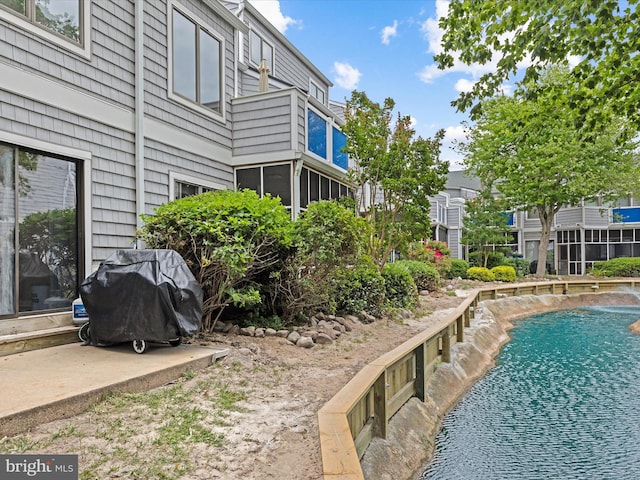 view of pool featuring grilling area