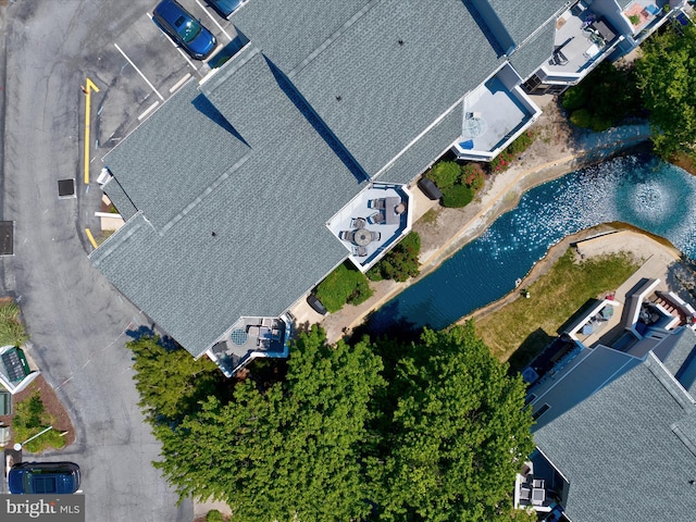 birds eye view of property featuring a water view