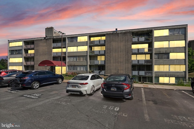 view of outdoor building at dusk