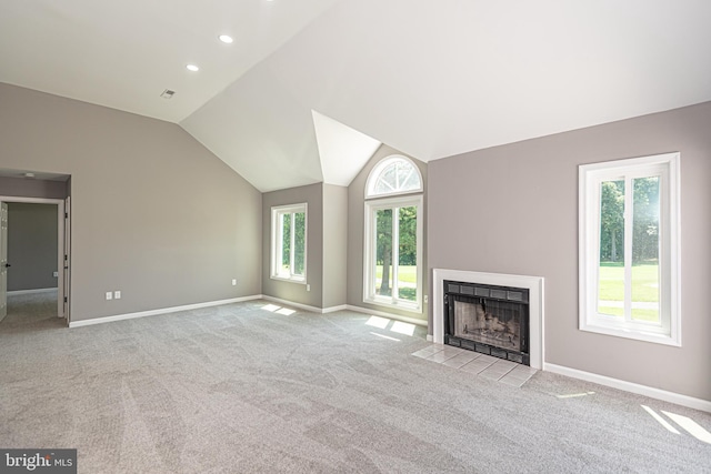 unfurnished living room with light carpet and lofted ceiling