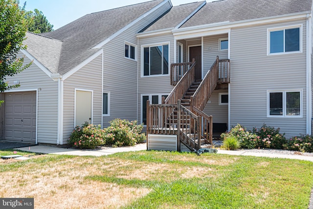 rear view of property with a lawn