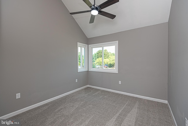 unfurnished room with ceiling fan, lofted ceiling, and carpet floors