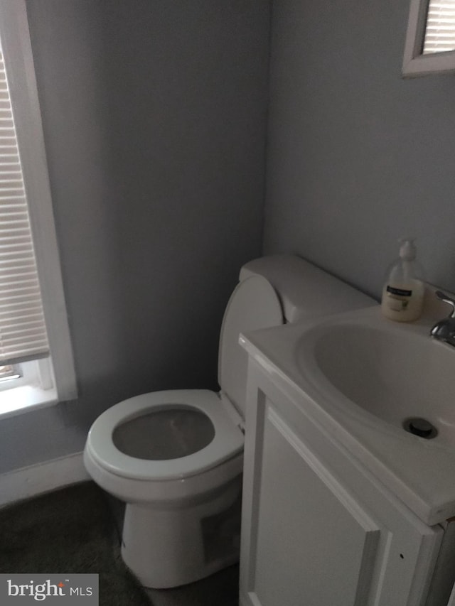 bathroom with vanity and toilet