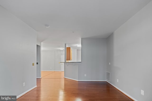 unfurnished living room featuring light hardwood / wood-style floors