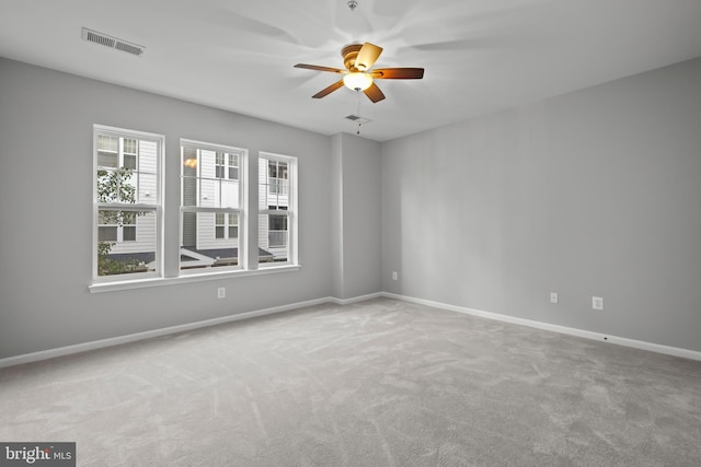 carpeted empty room with ceiling fan