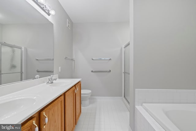 full bathroom featuring separate shower and tub, vanity, and toilet