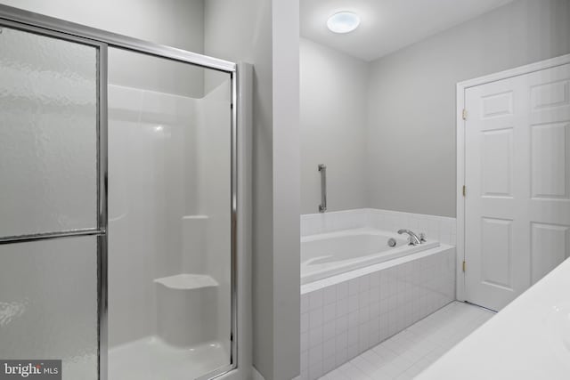 bathroom with separate shower and tub