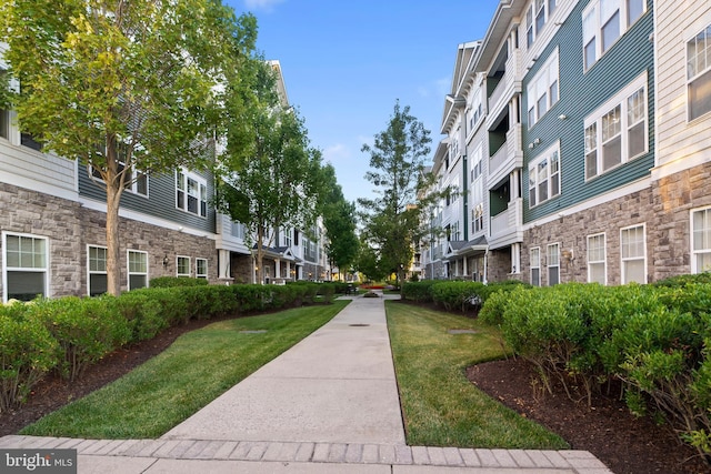 view of home's community featuring a lawn