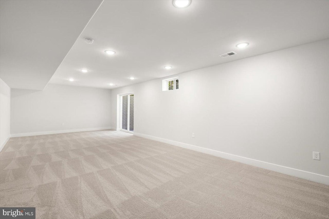 basement with light colored carpet