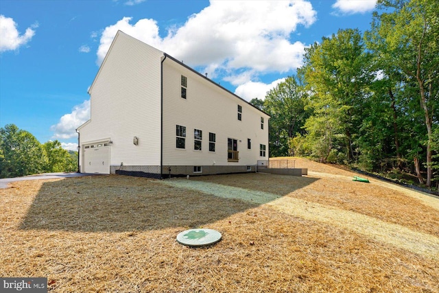 view of home's exterior with a garage