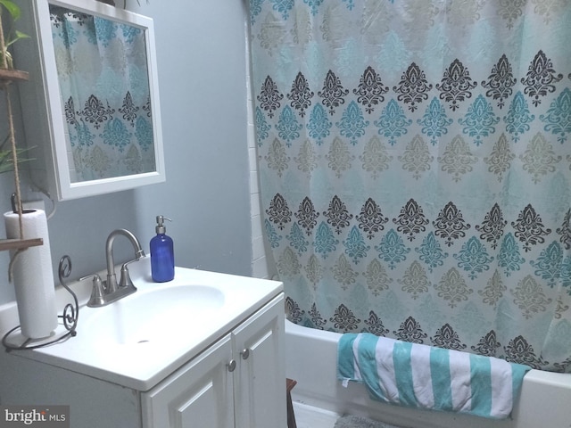 bathroom featuring vanity and tub / shower combination