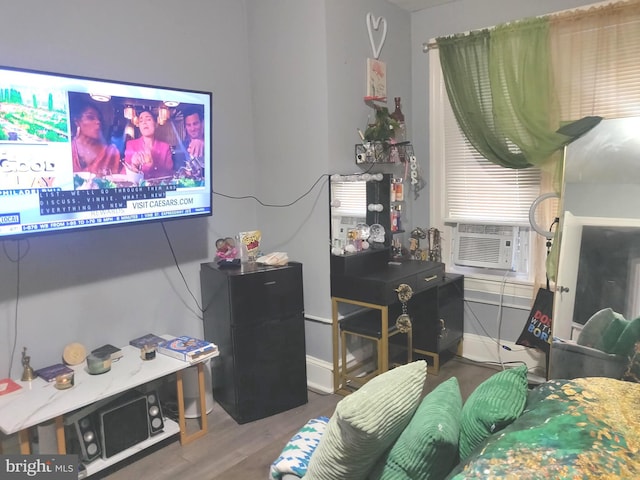 living room with hardwood / wood-style floors and cooling unit