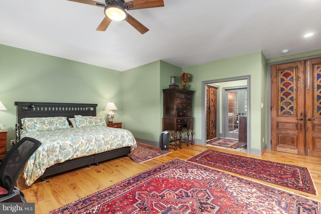 bedroom featuring light hardwood / wood-style floors and ceiling fan