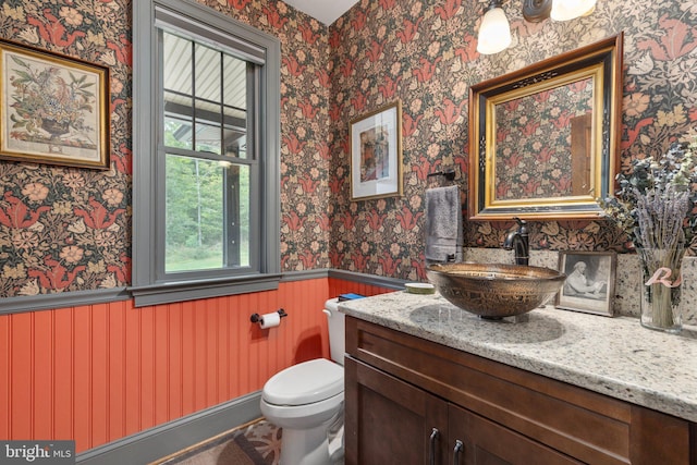 bathroom featuring vanity and toilet