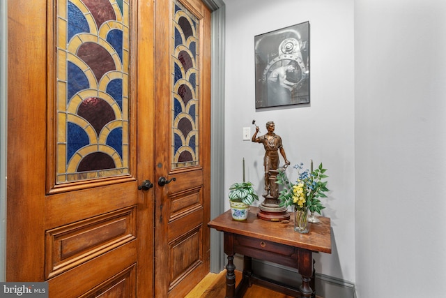 entryway with hardwood / wood-style flooring