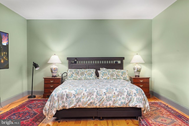 bedroom with light wood-type flooring