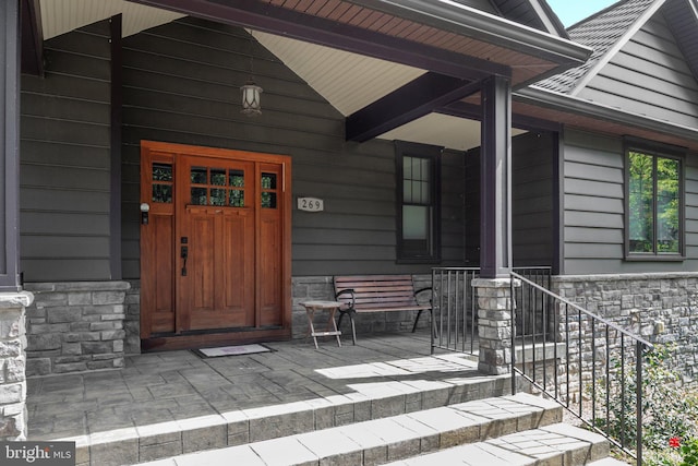 doorway to property featuring a porch