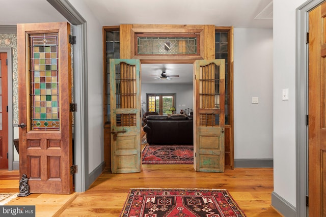 corridor featuring light hardwood / wood-style floors